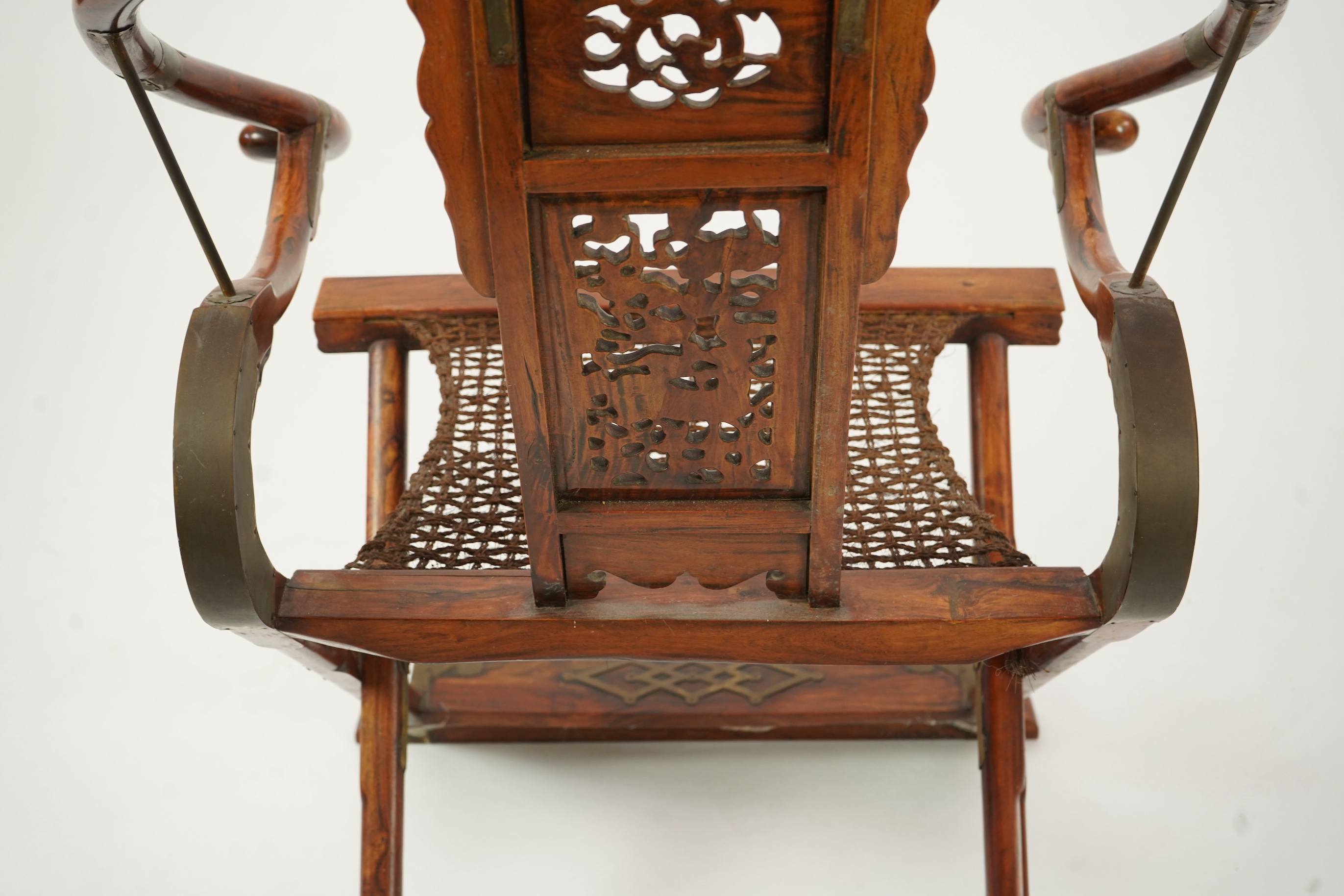 A Chinese huanghuali, hongmu and brass mounted folding hunting chair, jiaoyi, early 20th century